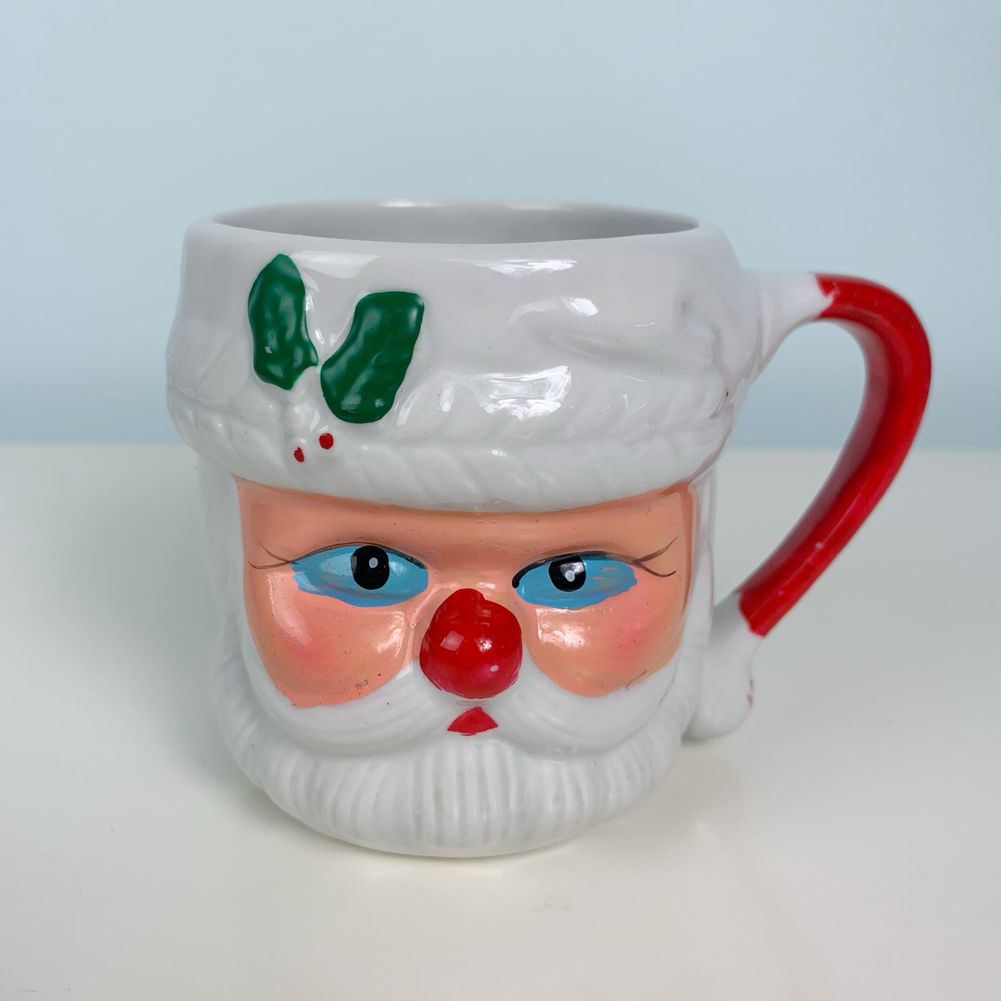 https://oldsoulgoodsco.com/cdn/shop/products/vintage-home-decor-christmas-blue-eyed-santa-mug_1024x1024@2x.jpg?v=1605749619