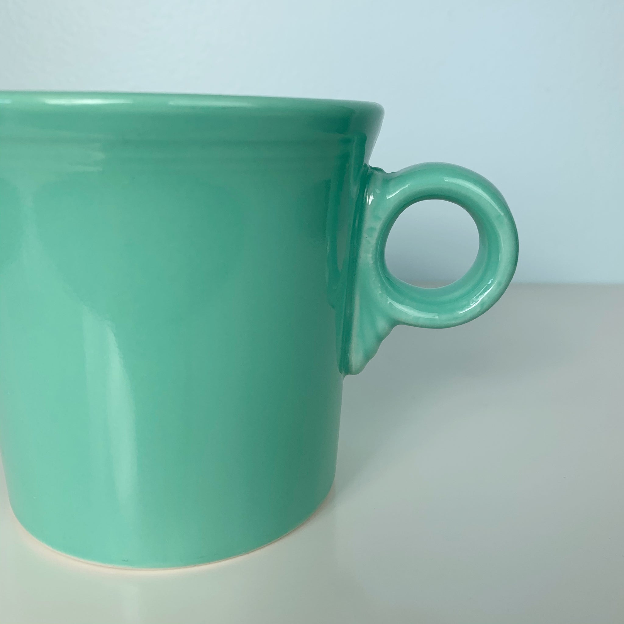 https://oldsoulgoodsco.com/cdn/shop/products/vintage-home-decor-green-fiesta-ware-mug-1_1024x1024@2x.jpg?v=1604281410